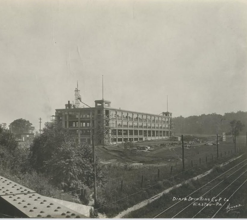 The Dixie Drinking Cup Company plant under construction in 1921, with railroad tracks in the foreground