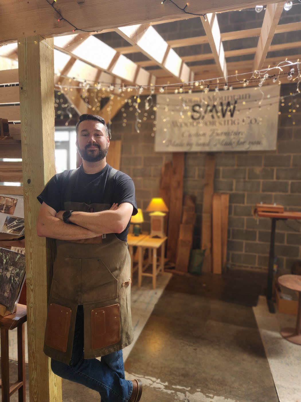 James Phillips standing at his booth at the Slatington Farmers Market.