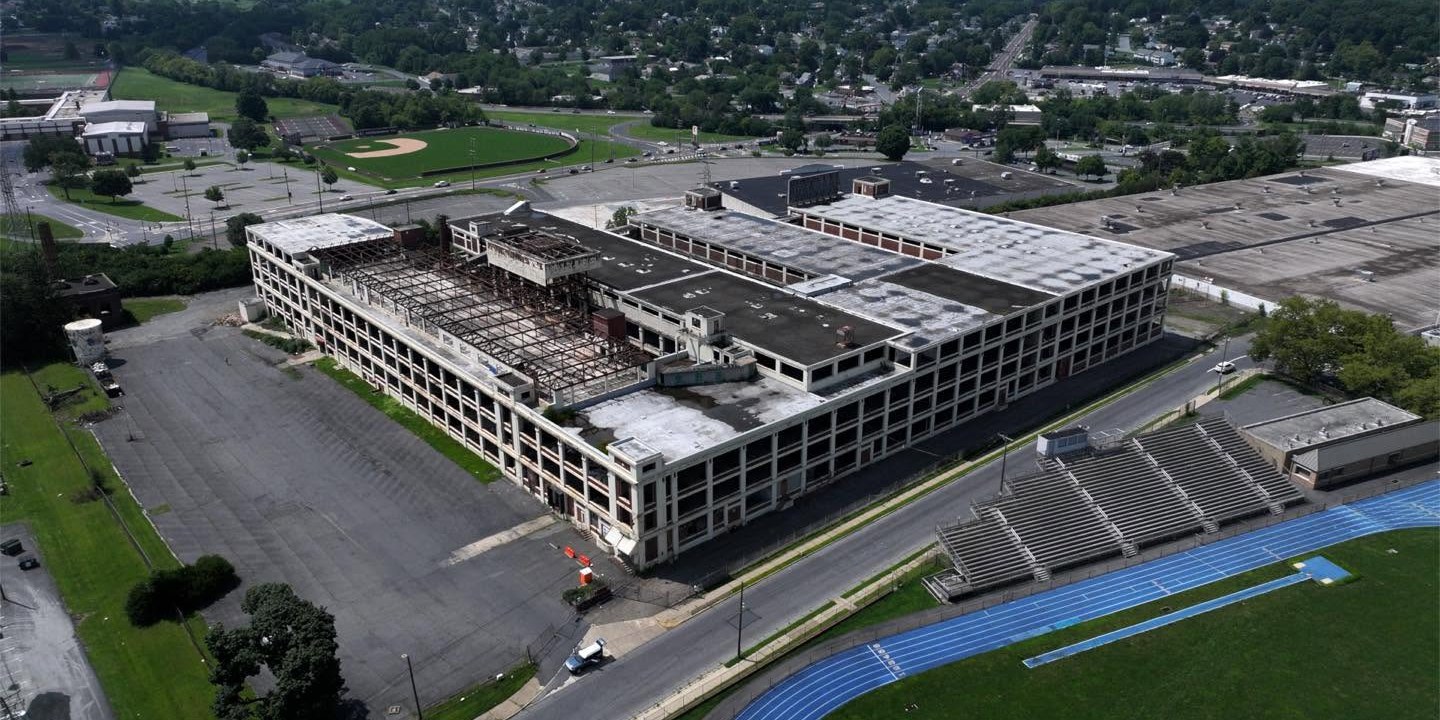 Aerial view of the gutted Dixie Cup factory complex in Wilson Borough with the high school track beside it