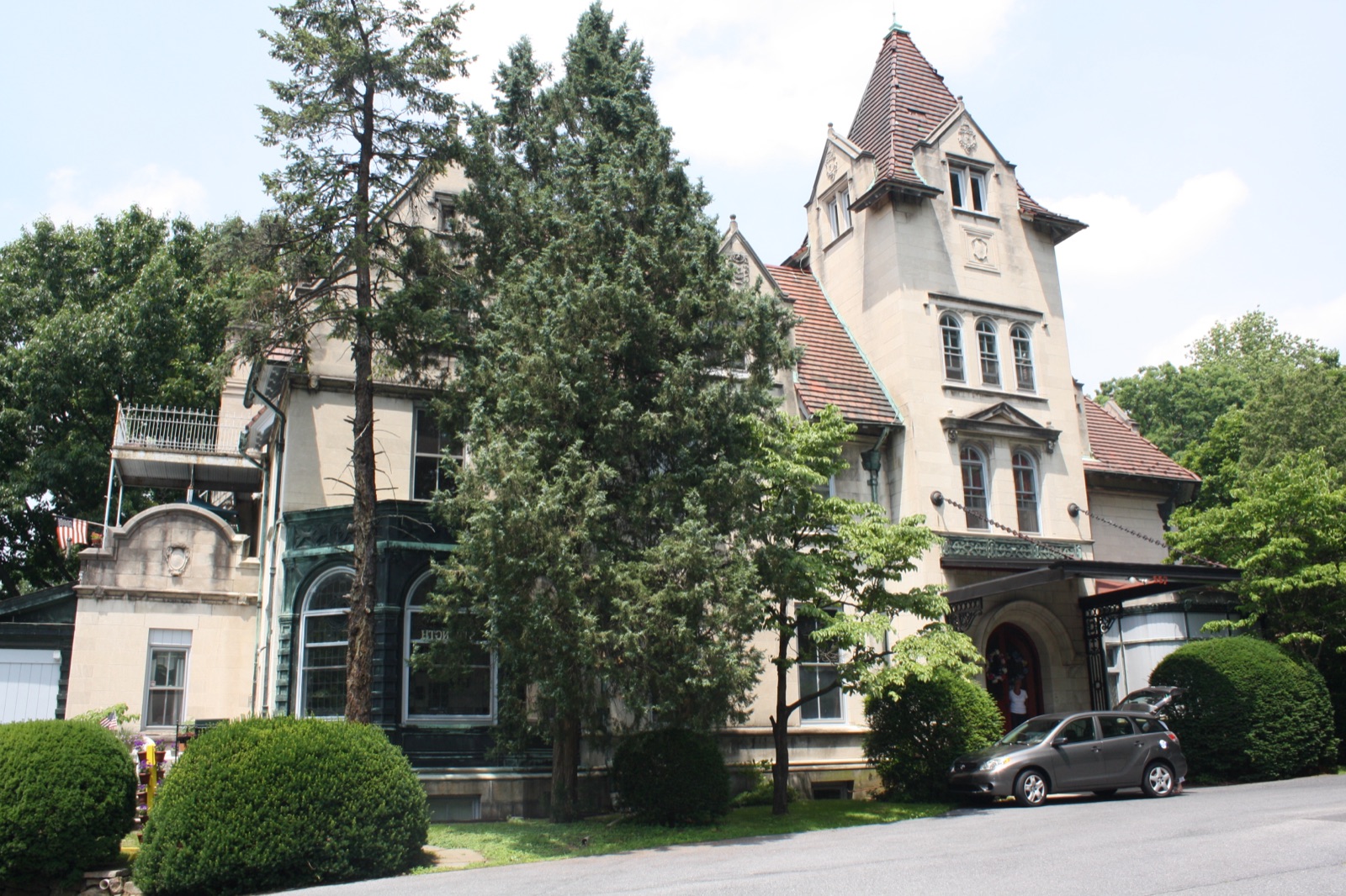 The Linderman-Schwab Mansion at 557 West Third Street, a three-story cut granite Chateauesque house
