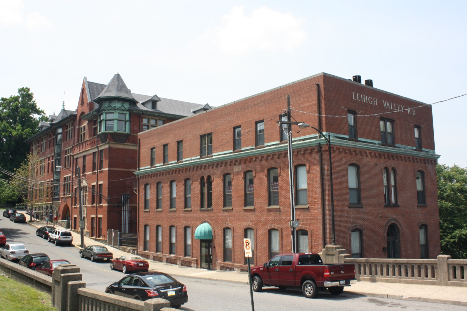 The Wilbur Trust building and the Lehigh Valley Railroad headquarters, two red brick buildings with the railroad's name cut into the brickwork