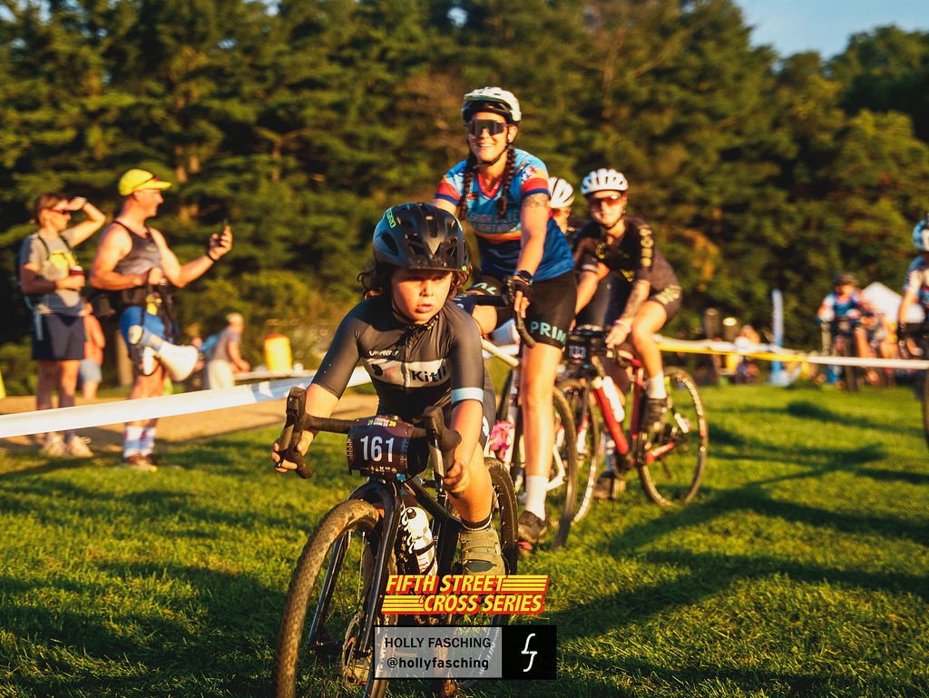 A young boy on a mountain bike races at Fifth Street Cross