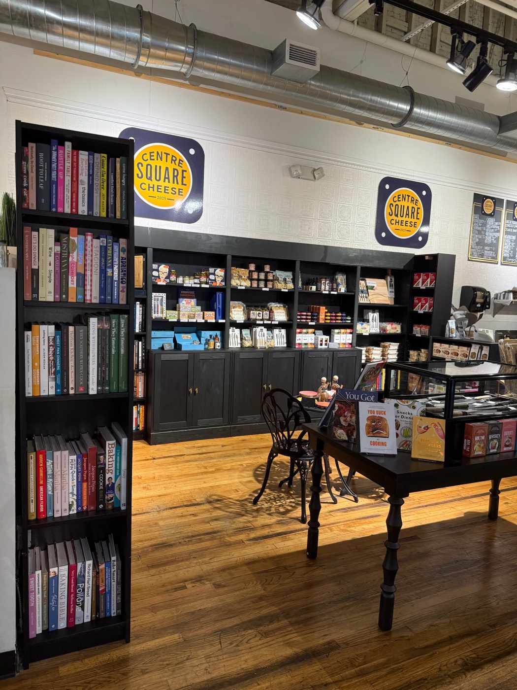 Interior of Centre Square Cheese with cookbook shelves and pantry goods