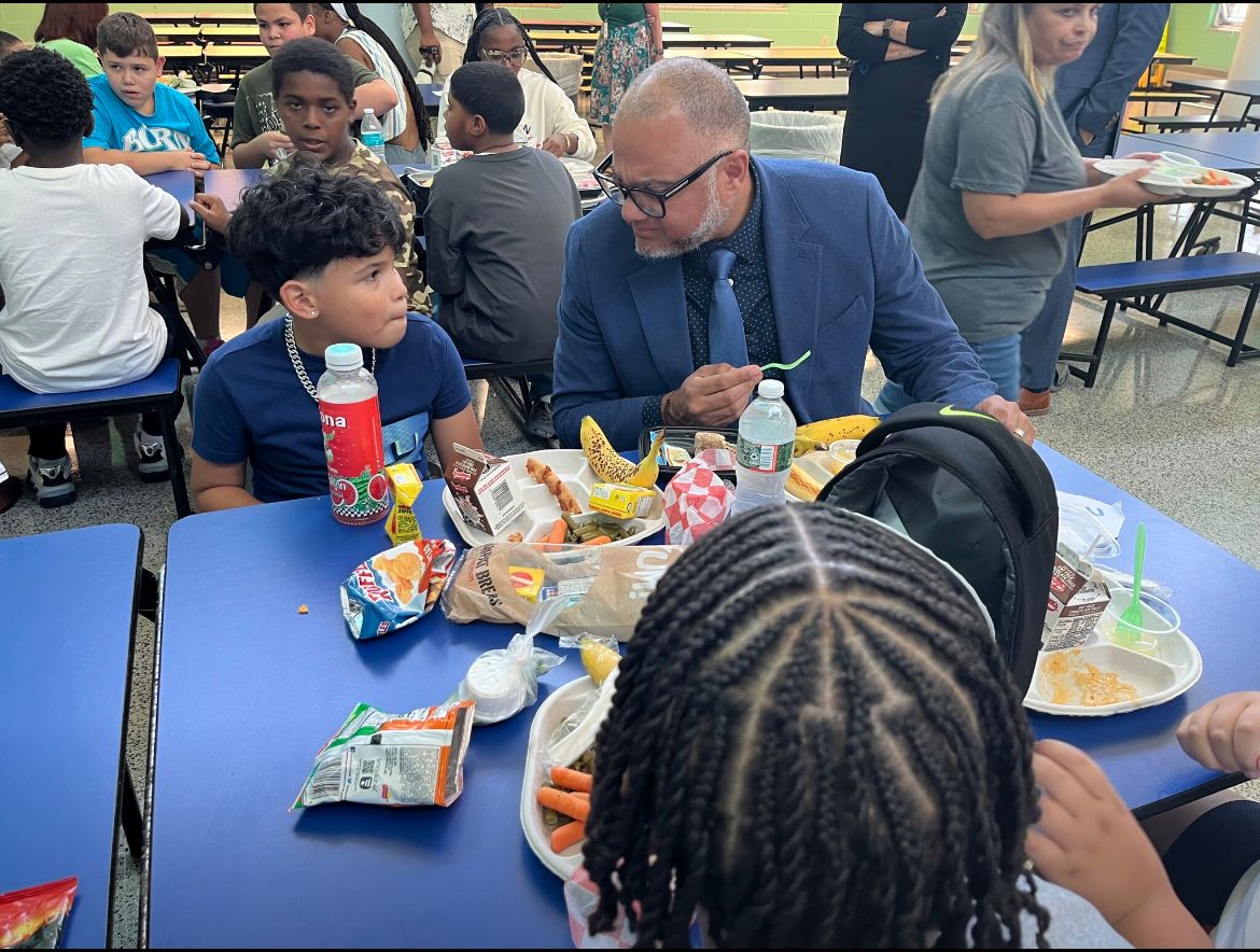 Superintendent Renato Lajara visits with students during lunch